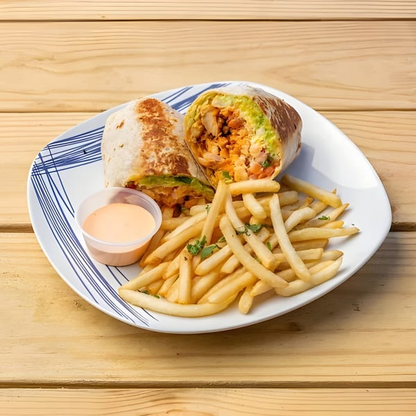 Aztk Mexican restaurant's chicken burrito, cut in half, with a side of fries and dipping sauce.